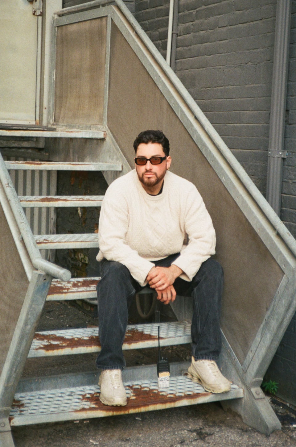 Cristian Palacios seated on a staircase